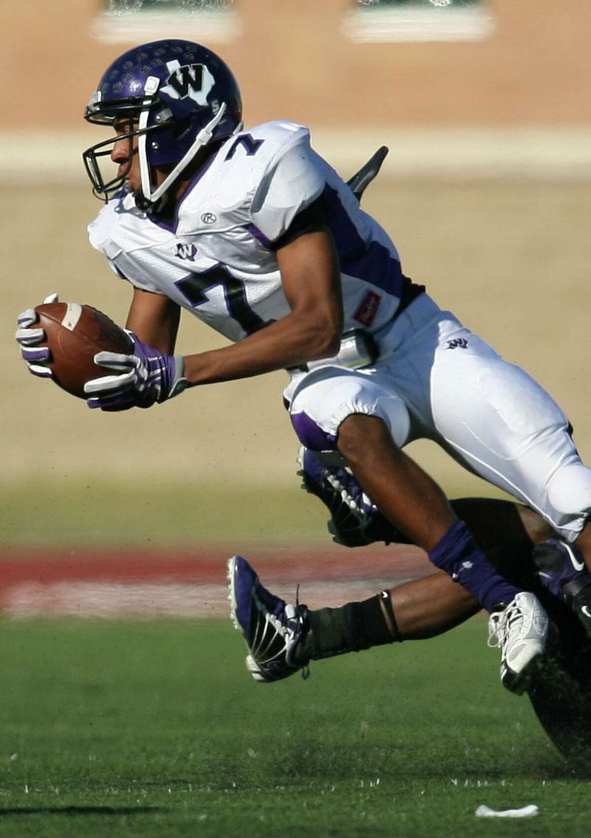 Willis wide receiver Quan West leaps for a first down during Saturday's game against Humble at Turner Stadium in Humble. To purchase this photo or others like it, visit: http://hcnonline.mycapture.com