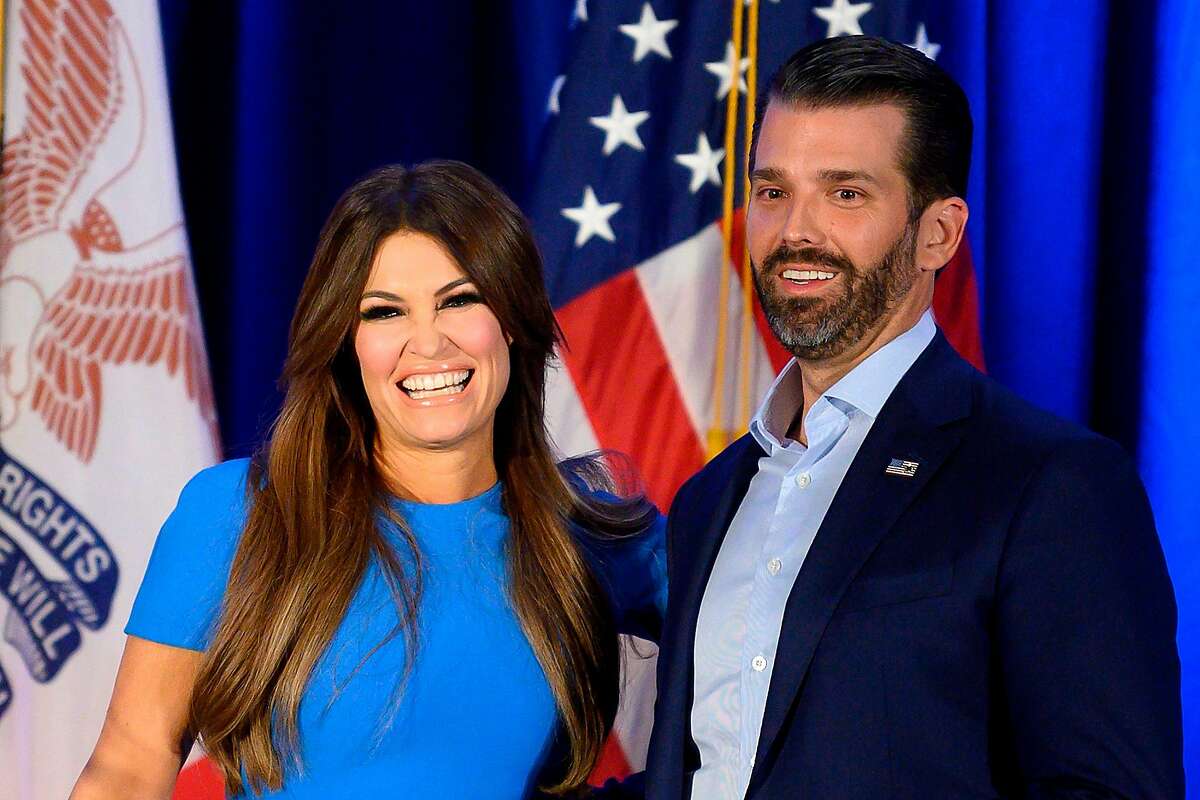 In this file photo taken on February 3, 2020 Donald Trump Jr. (R) and his girlfriend Kimberly Guilfoyle smile during a "Keep Iowa Great" press conference in Des Moines, IA.