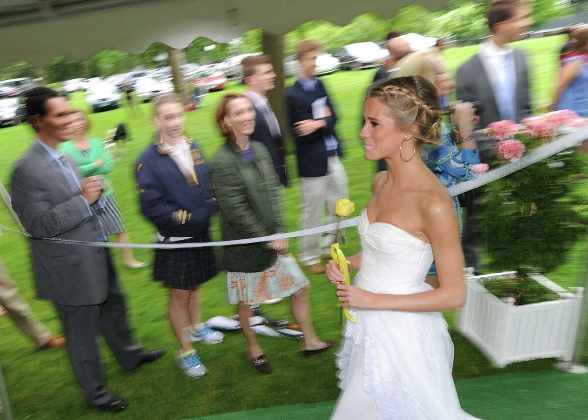 She may be dressed in white, but this isn’t her wedding. Then-18-year-old Cassidy Gifford, of Greenwich, during her Greenwich Academy graduation at the main campus in Greenwich, Thursday, May 24, 2012.
