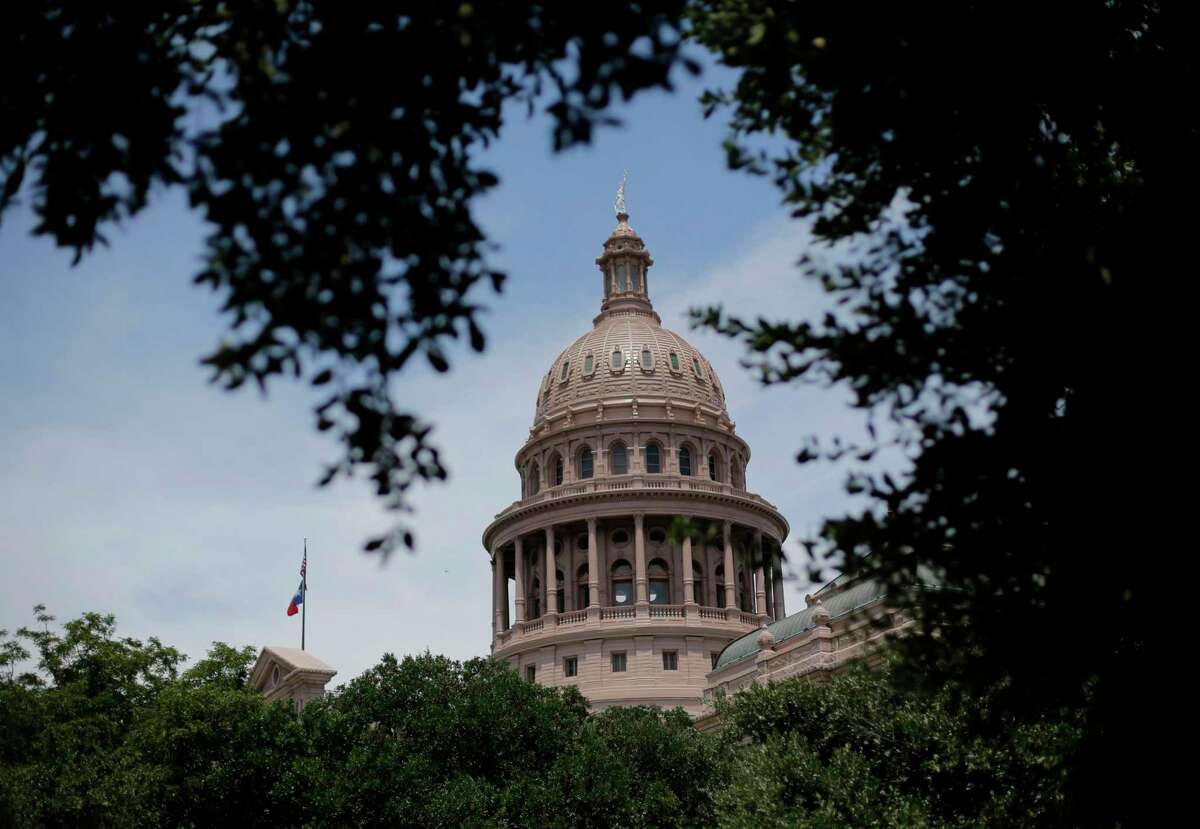 The dome of the Texas State Capital is seen through trees in Austin, Texas. The Texas Workforce Commission, a state agency that oversees unemployment benefits, is investigating cases of identity theft for unemployment benefits.