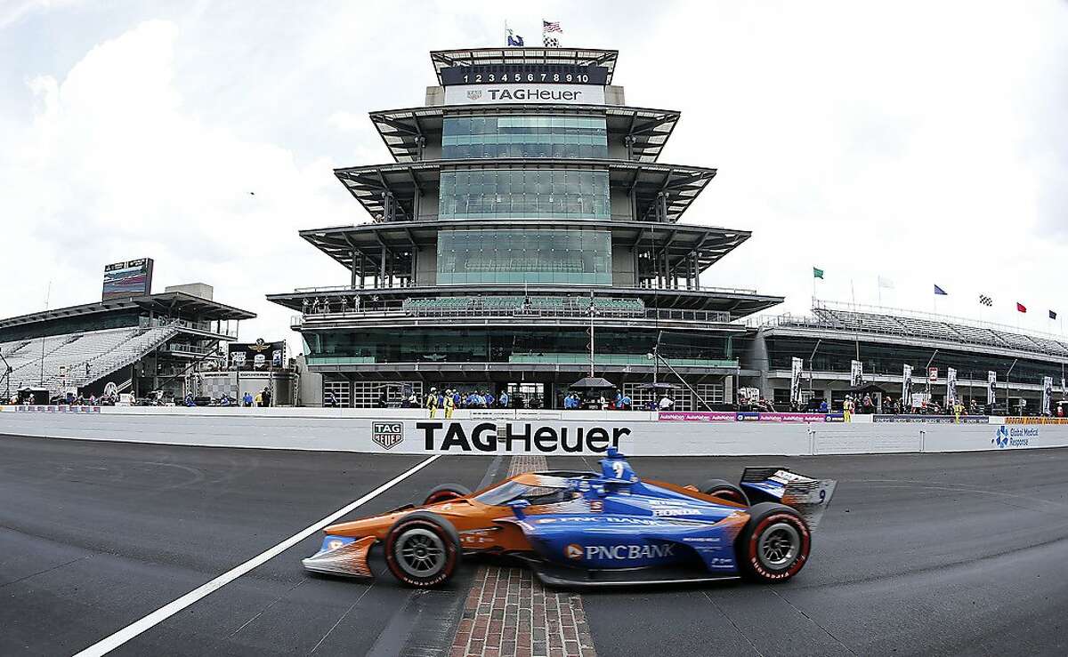 INDIANAPOLIS, INDIANA - JULY 04: Scott Dixon, driver of the #9 PNC Bank Chip Ganassi Racing Honda, crosses the finish line to win the NTT IndyCar Series GMR Grand Prix at Indianapolis Motor Speedway on July 04, 2020 in Indianapolis, Indiana. (Photo by Jamie Squire/Getty Images) *** BESTPIX ***