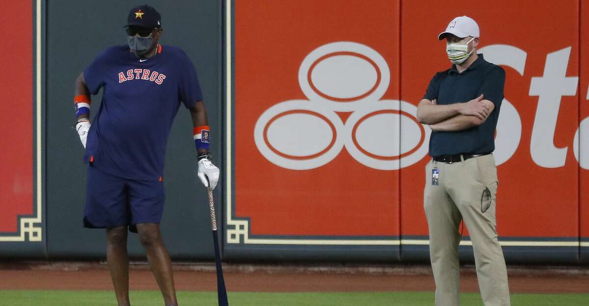 Houston Astros manager Dusty Baker stands in the outfield with general manager James Click during the Astros summer camp at Minute Maid Park, Saturday, July 4, 2020, in Houston.