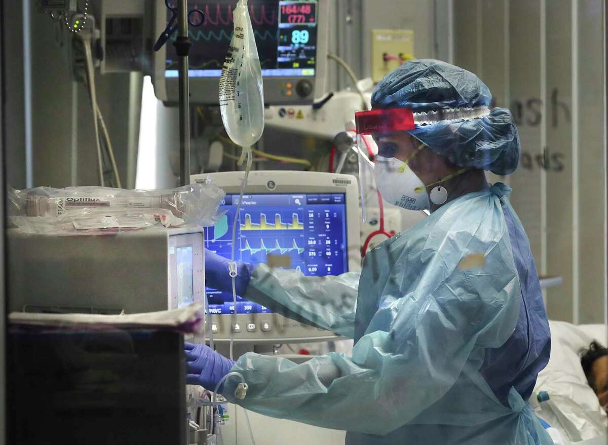 Covid nurse Tracie Sandoval cares for a patient in one of the four covid units at the Methodist Hospital.  San Antonio had a massive influx of coronavirus patients to its hospital on Thursday, June 25, 2020.