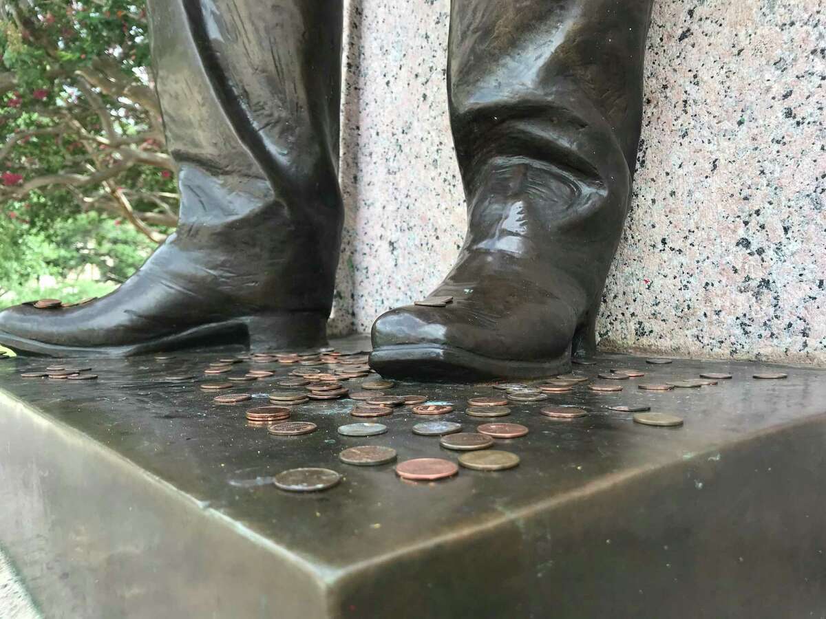 Aggies leave pennies at ‘Ol Sully’s’ feet for good luck on exams.