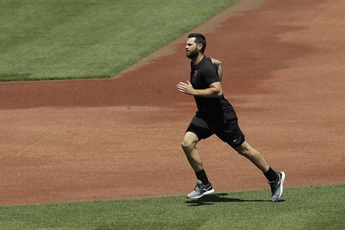 San Francisco Giants' Brandon Belt runs during a baseball practice on Friday, July 3, 2020, in San Francisco. (AP Photo/Ben Margot)