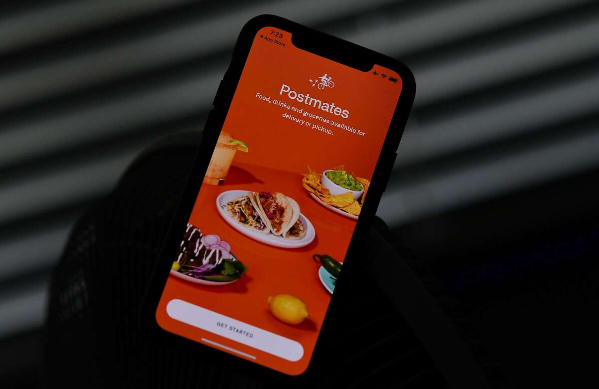This illustration photo taken on June 30, 2020 shows the delivery app Postmates on a smartphone screen in Los Angeles. - Uber is in talks to buy food delivery app Postmates in a multibillion dollar deal, US media reported. (Photo by Chris DELMAS / AFP) (Photo by CHRIS DELMAS/AFP via Getty Images)