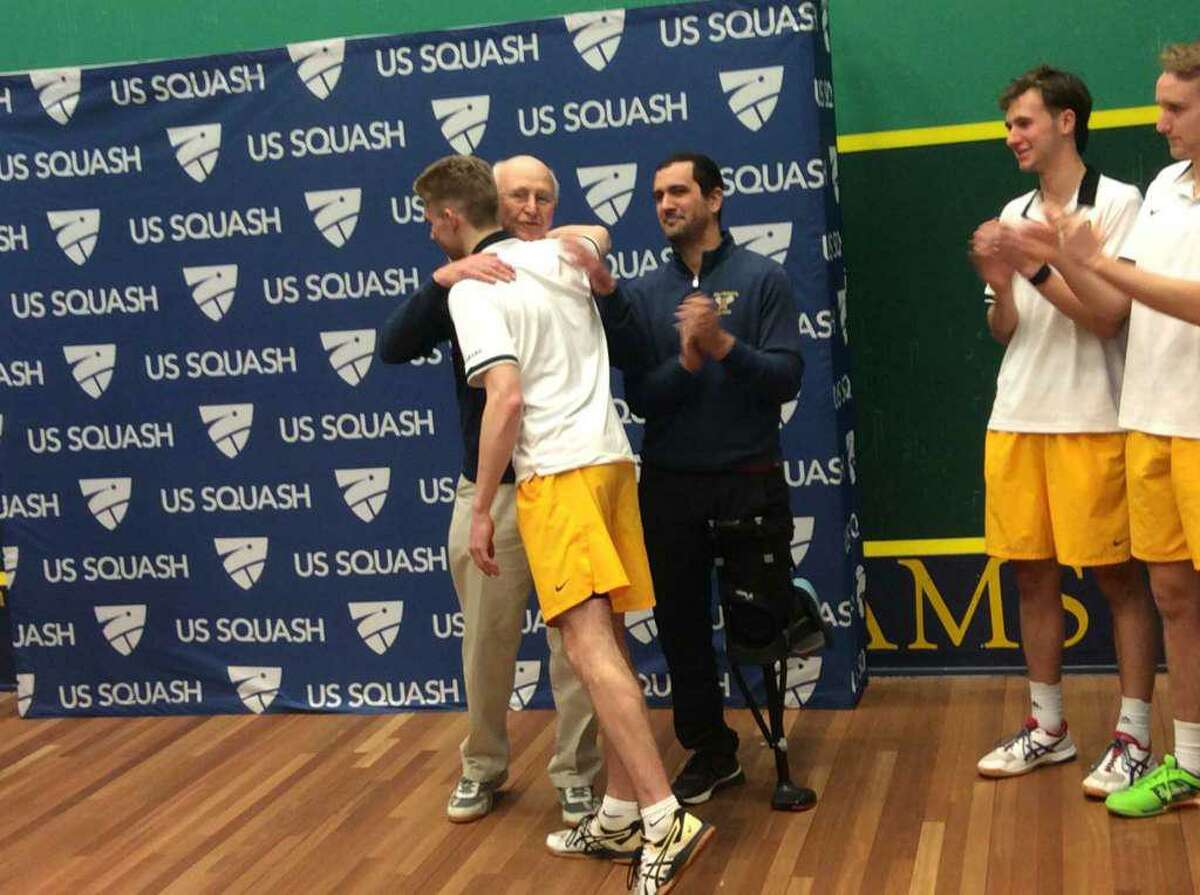 Brunswick School squash coach Jim Stephens embraces standout player Brian Leonard, after the Bruins won the Division I title at the U.S. High School Team Squash Championships in February. Stephens was recognized following the tournament for his contributions to high school squash. After teaching and coaching at Brunswick for 35 years, Stephens has retired.