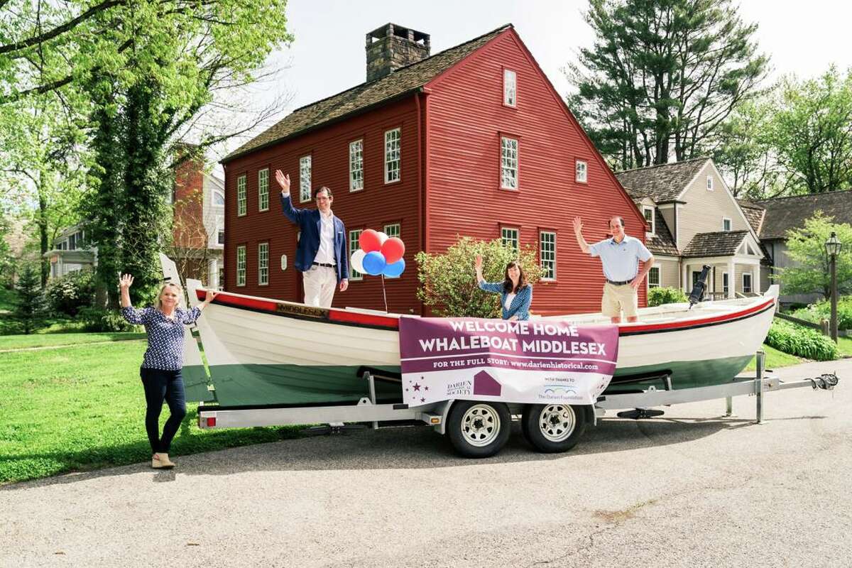 The Whaleboat Middlesex in ship shape after a nearly 40-year odyssey, thanks to a generous grant from The Darien Foundation, will be part of the bicentennial celebrations. From left, Maggie McIntire, executive director of the Darien Historical Society, Robert J. Pascal, Jr., president of the Darien Historical Society, Sarah Woodberry, executive director of The Darien Foundation and Ward Glassmeyer, chairman of The Darien Foundation.