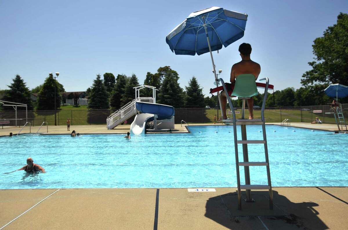 Swimmers are spaced out during opening day at the Tashua pool in Trumbull on Monday. Residents need to sign up for visits in advance, with a maximum of 50 visitors allowed at a time.