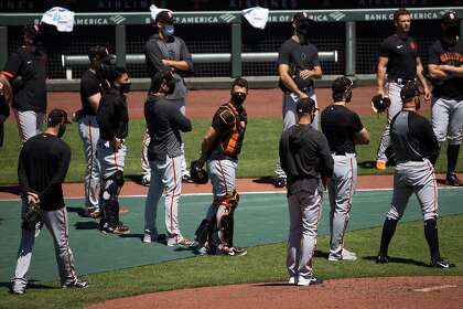 Giant catcher Buster Posey, middle, said he could choose this season and said: