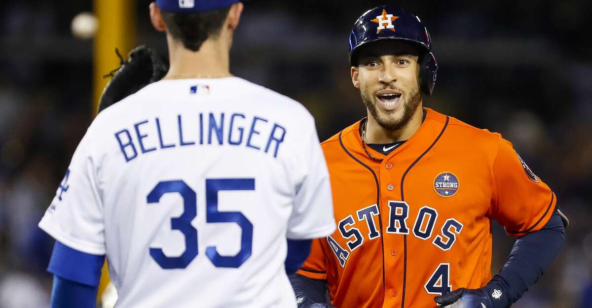 Houston Astros center fielder George Springer (4) reacts to Los Angeles Dodgers first baseman Cody Bellinger (35) after center fielder Chris Taylor (3) caught a line drive in the seventh inning of Game 7 of the World Series at Dodger Stadium on Wednesday, Nov. 1, 2017, in Los Angeles. ( Karen Warren / Houston Chronicle )