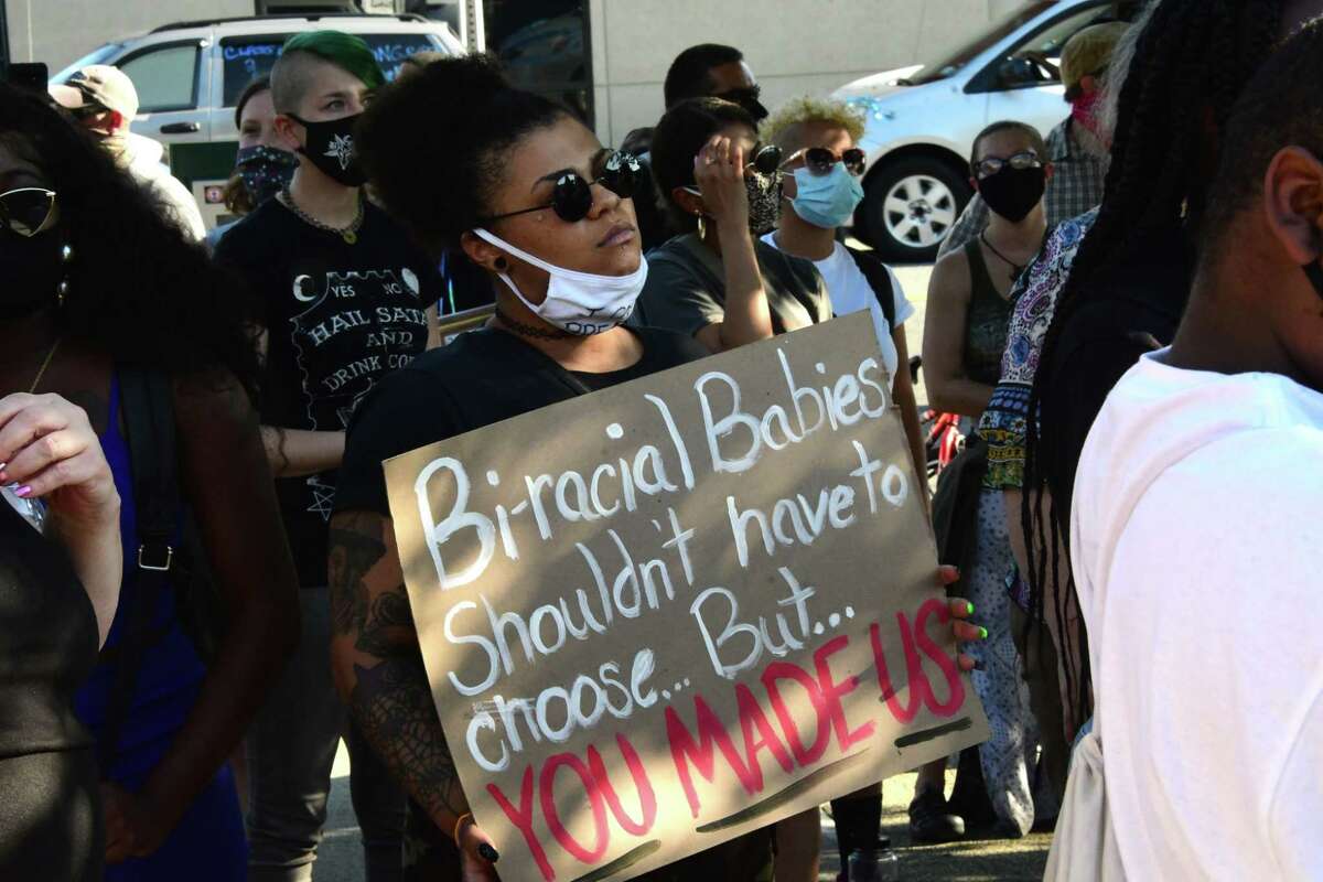Protesters express their anger outside Schenectady Police Headquarters after a police officer was photographed kneeling on the neck of a man he was trying to apprehend on Brandywine Avenue on Monday, July 6, 2020 in Schenectady, N.Y. (Lori Van Buren/Times Union)