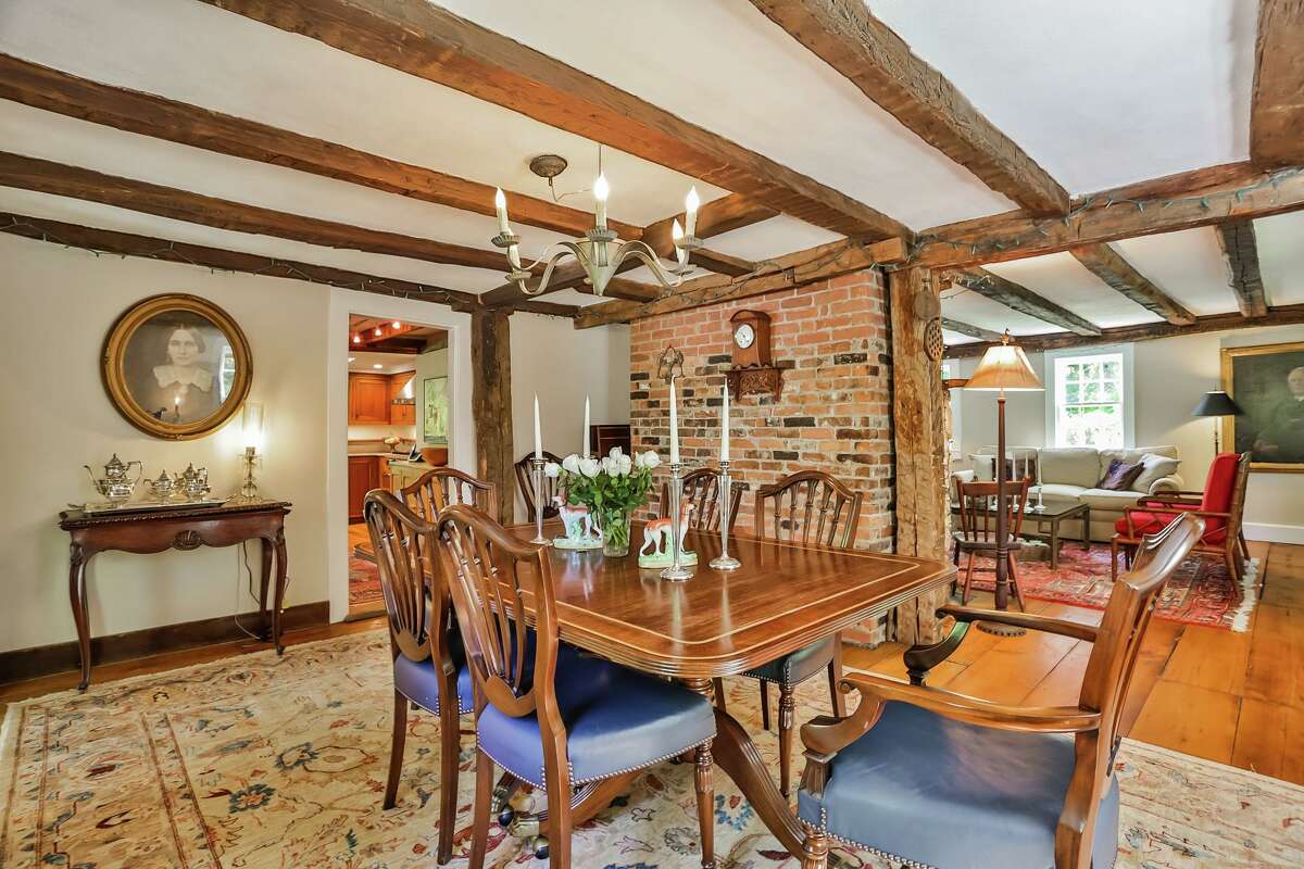 The banquet-sized formal dining room features exposed posts and beams and wide-board flooring. Despite the age of this nine-room, 3,023-square-foot house, it has a great flow for day-to-day living and entertaining, and the banquet-sized formal dining room can seat up to 18 people, the agents said. Entertaining is further enhanced by the gourmet chef’s kitchen, which features Italian soapstone counter tops, a large farm sink, built-in hutch and high-end appliances.