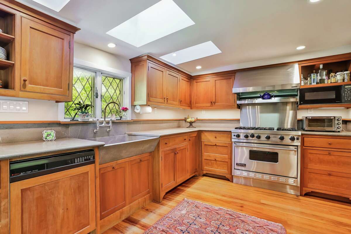 In the gourmet kitchen there is Italian soapstone countertops, a large farm sink, built-in hutch and high-end appliances. Unlike some houses of this vintage, its exterior and interior paint colors are current and neutral. Other modern amenities include a city water connection and access to the natural gas line, which is already piped to the house, although, currently the utilities run on oil. Still, vestiges of centuries gone by remain in the antique ceiling beams and wall posts, and wide-board floors.
