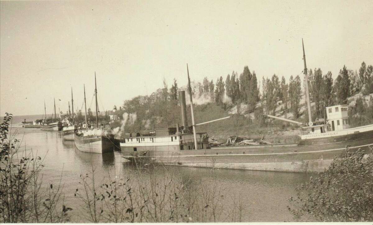 One of the popular ways of shipping lumber and other items to Manistee and other ports of destination around the Great Lakes in the 1890s and early 1900s were schooners that line the Manistee River Channel in this picture.
