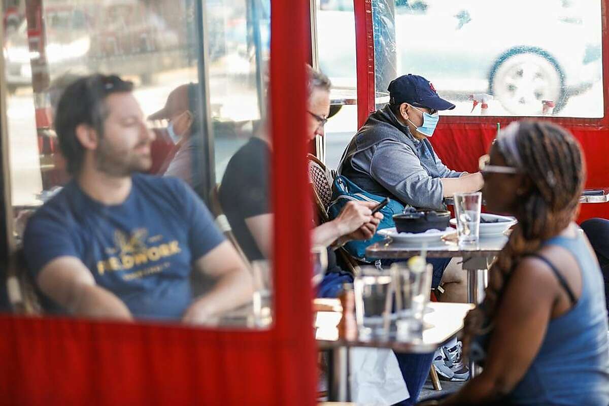 People eat outdoors at Chez Maman restaurant in Hayes Valley on Wednesday, June 17, 2020 in San Francisco, California.