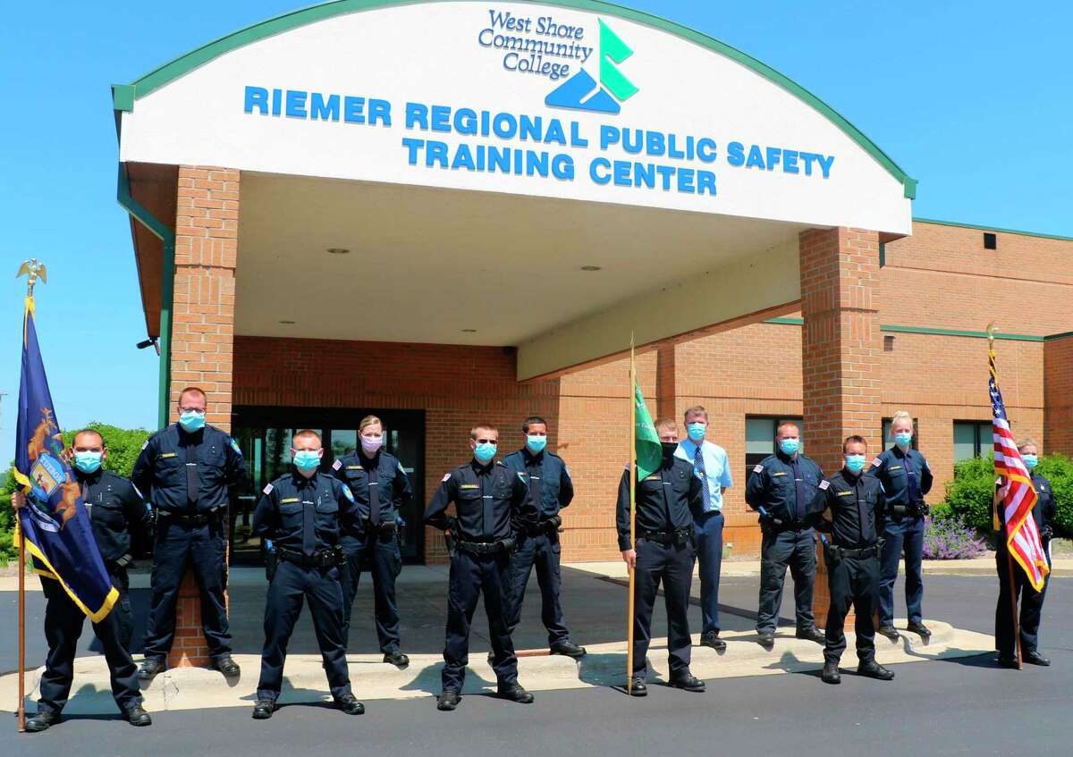 The 2020 West Shore Community College Police Academy graduates stand in front of the Riemer Regional Public Safety Training Center following their graduation. The class had to overcome many obstacles on the way to graduation due to the COVID-19 pandemic. (Courtesy photo)