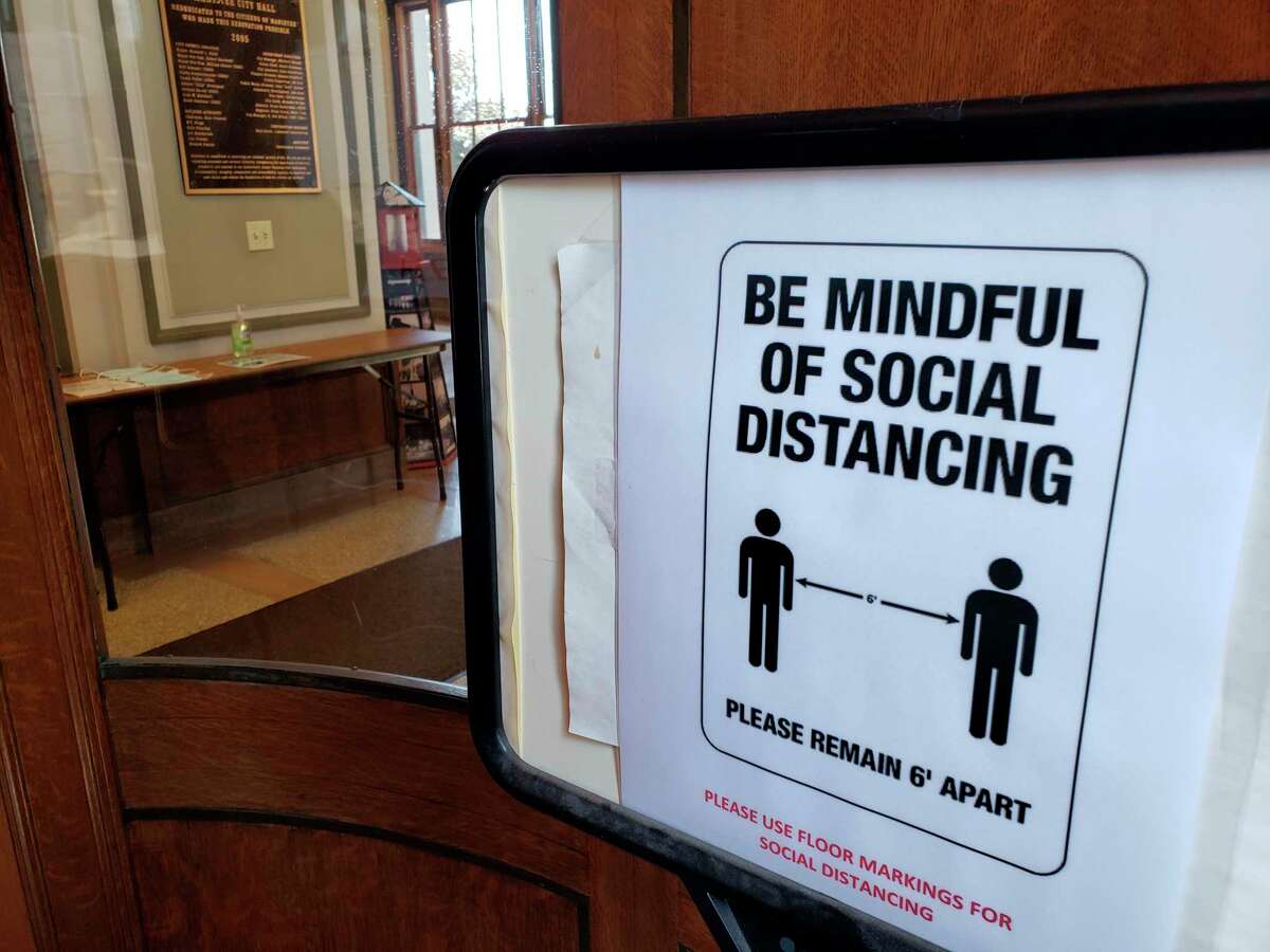 Manistee City Hall reopened Tuesday after being closed to the public since March 17 during the pandemic. The building now features one-way traffic flow, hand sanitizing stations, mask requirements and social distancing reminders. (Arielle Breen/News Advocate)