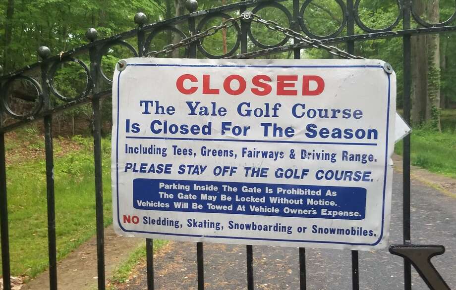 The sign to the Yale Golf Course in New Haven indicating the course is closed. Photo: Joe Morelli / Hearst Connecticut Media