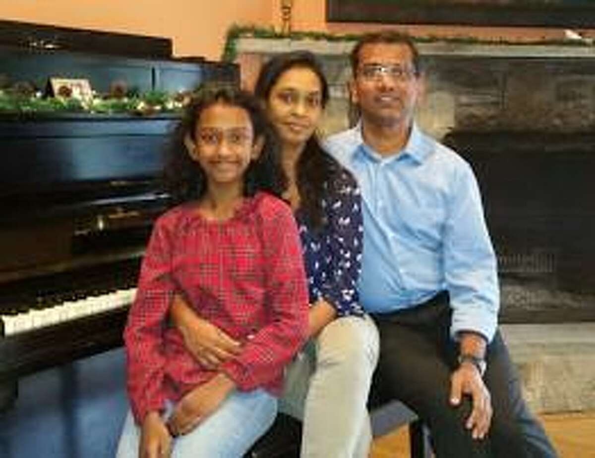 The Rev. Jitesh Immanuel Soans is the new pastor of Sherman Congregational Church. He is shown above with his wife, Lora Kumar, and their 10-year-old daughter, Geneene.