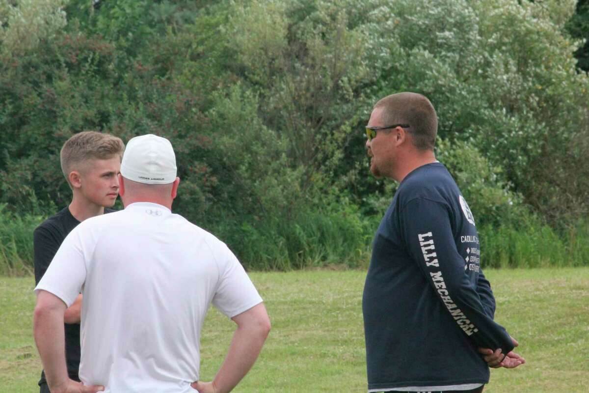 Reed City soccer coach Chris Maddox (right) holds a discussion during a summer practice last year. (Herald Review file photo)
