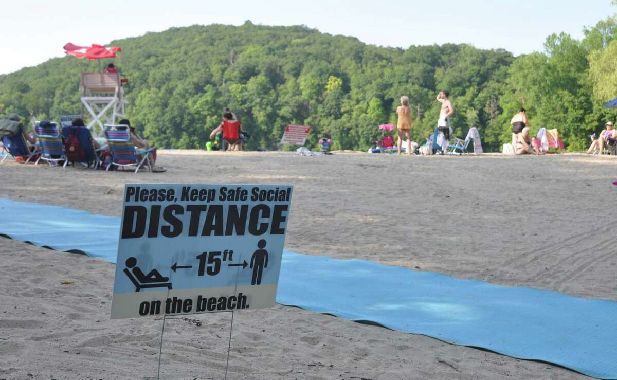 A sign at Ridgefield's Martin Park Beach announces a required 15-foot distance between groups just a few months into the coronavirus pandemic.