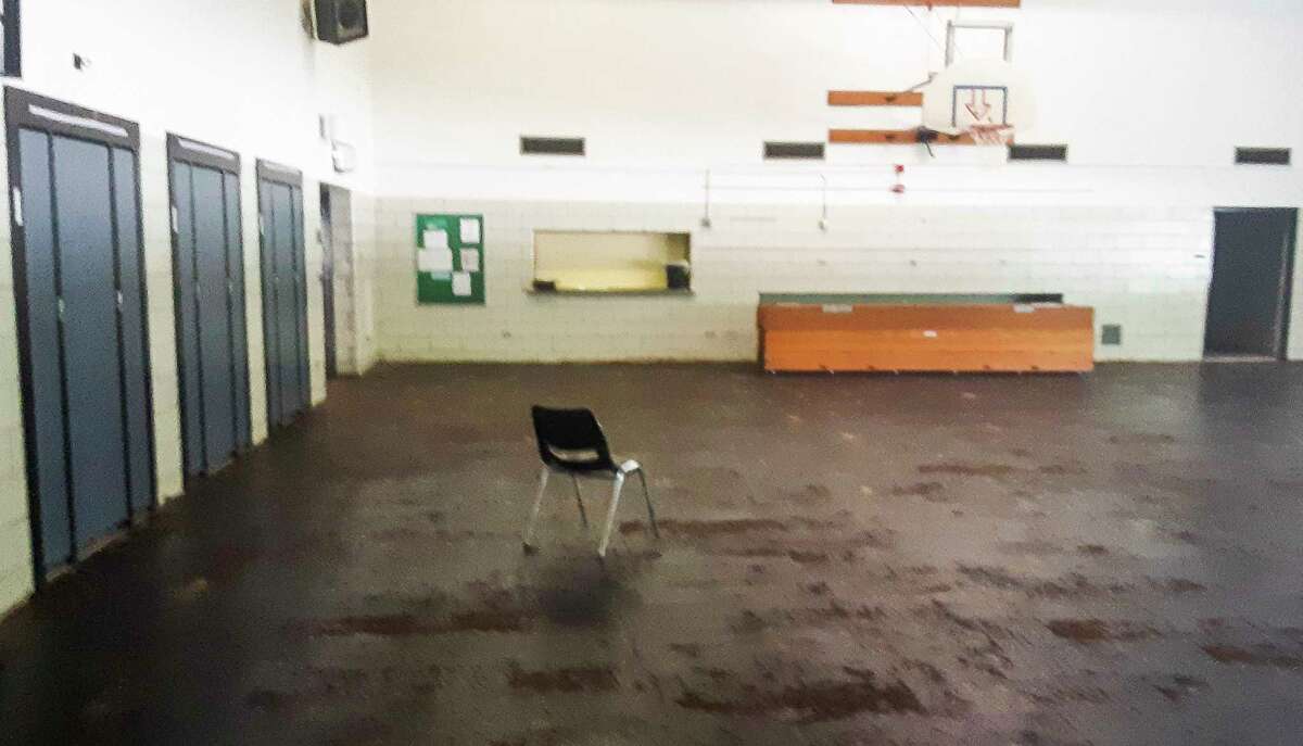 The wooden floor of the Windover High School gym was ruined by the flood in May and had to be removed. The school is undergoing extensive repairs in hopes of being open for the first day of the fall semester on Aug. 31. (Dan Chalk/chalk@mdn.net)