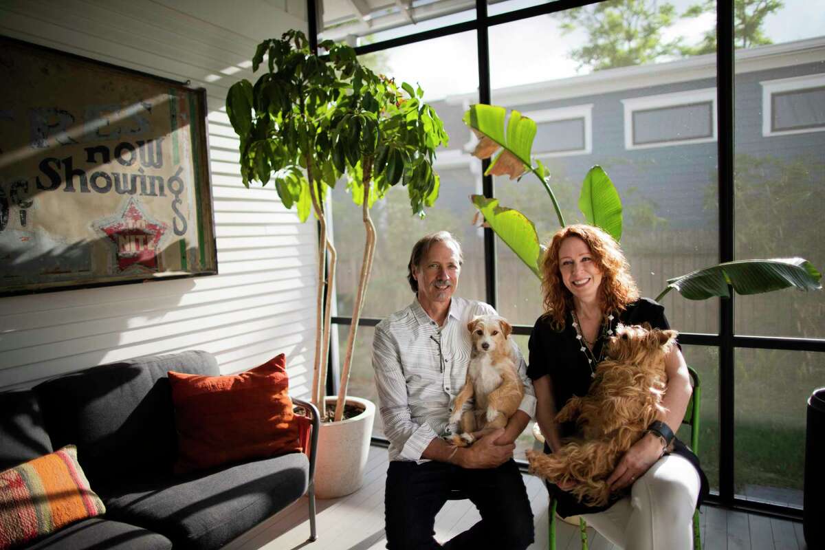 Jack Massing, and his wife Star Massing with their dogs Cali and Dengue at their home