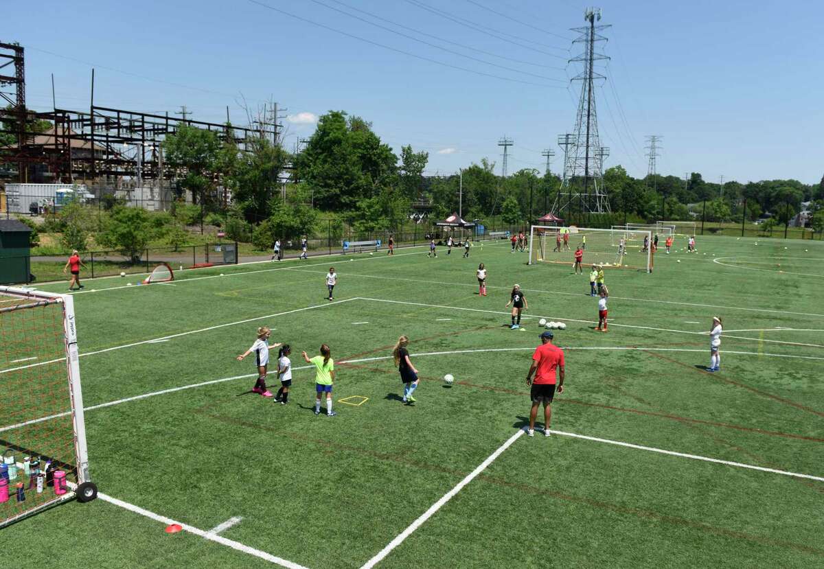 Cardinal Soccer Camps use the playing field at Cos Cob Park in the Cos Cob section of Greenwich, Conn. Monday, July 6, 2020.
