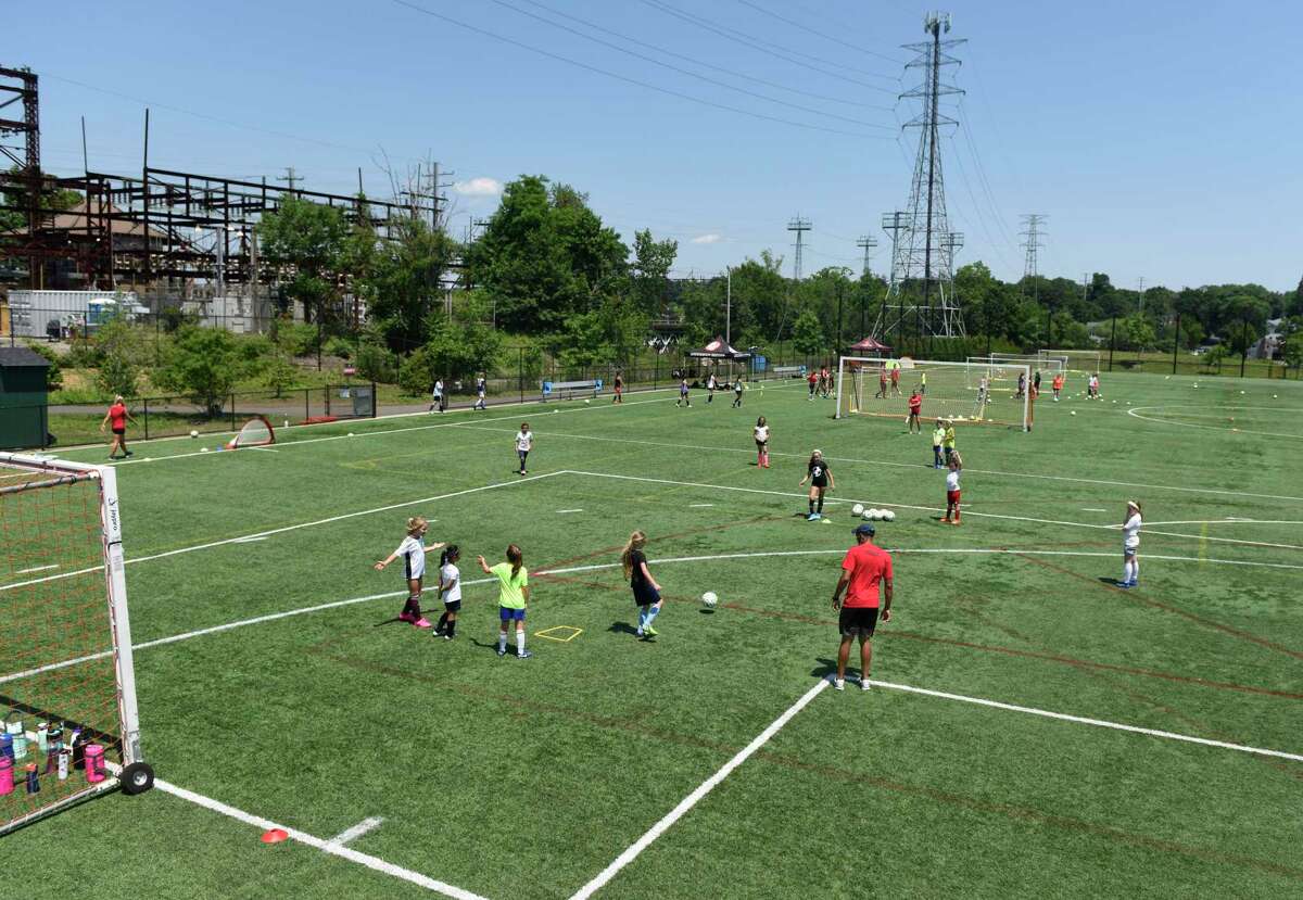 Cardinal Football Camps use the Cos Cob Park Playground in the Cos Cob section of Greenwich, Connecticut on Monday, July 6, 2020.