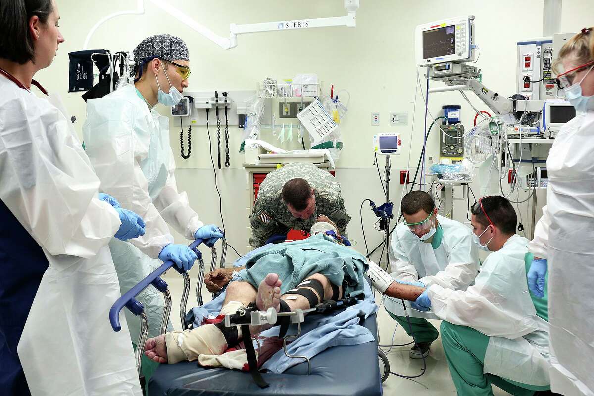 A trauma patient is treated at Brooke Army Medical Center in 2015. A Pentagon policy has sidelined BAMC in treating civilian COVID-19 cases as area hospitals approach capacity.