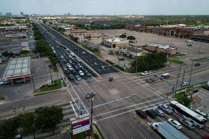The contrast between a newly resurfaced Westheimer Road and the old surface is visible at the intersection with Dairy Ashford, seen July 8, 2020, in west Houston. A project to resurface Westheimer is wrapping up six months ahead of schedule because COVID cleared the way for faster work. Crews with Angel Brothers switched to a 24-hour cycle to take advantage of lower traffic and basically cut the construction time in half.