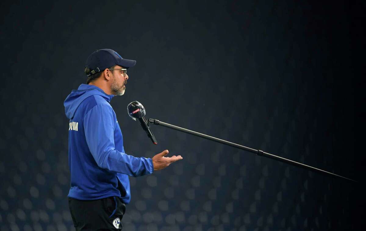 FILE - In this Sunday, June 14, 2020, file photo, Schalke's German head coach David Wagner gives an interview before the German Bundesliga soccer match between FC Schalke 04 and Bayer Leverkusen in Gelsenkirchen, Germany. Many familiar pregame sights won't be taking place when baseball and the NBA return later this month. Managers won't be exchanging lineup cards at home plate, first pitches will be in the top of the first instead of pregame and basketball lineup introductions might be a little more socially distant. (Ina Fassbender/Pool via AP, File)