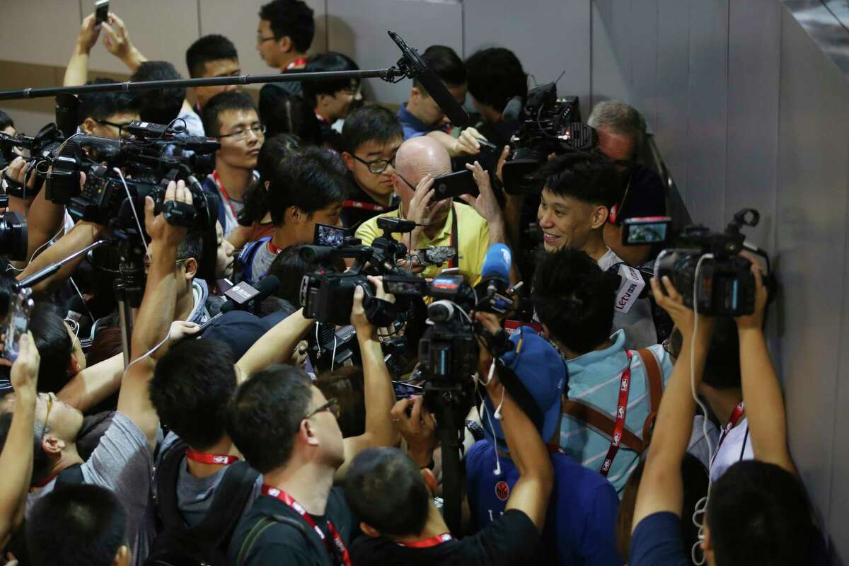 FILE - In this Oct. 10, 2015, file photo, NBA basketball player Jeremy Lin of the Charlotte Hornets talks to media after a training session for the 2015 NBA Global Games in Shenzhen, China. As sports prepare to resume, journalists are facing the same reckoning that their colleagues who cover politics, education and entertainment have encountered a€?