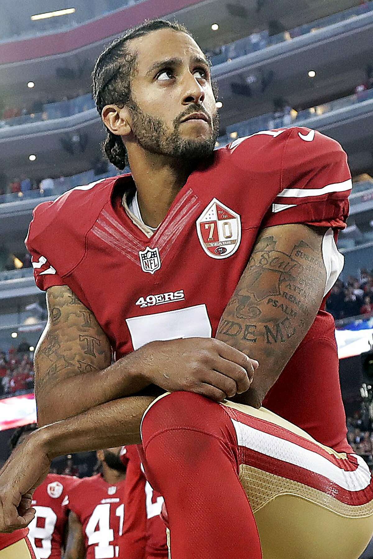 San Francisco 49ers QB Colin Kaepernick looks for a receiver from his own  end zone in the second quarter against the Oakland Raiders at O.co Coliseum  in Oakland, California on December 7