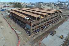 Historic Building 12 at Pier 70 is being lift 10 feet for sea level rise protection. Building 12 will be at the same level as the new roads pictured here.