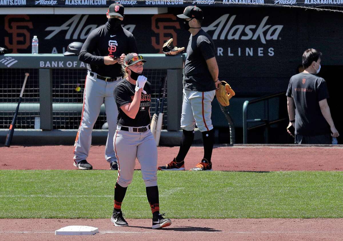 Alyssa Nakken walks toward the outfield as the San Francisco Giants worked out and played a simulated game at Oracle Park in San Francisco, Calif., on Wednesday, July 8, 2020.