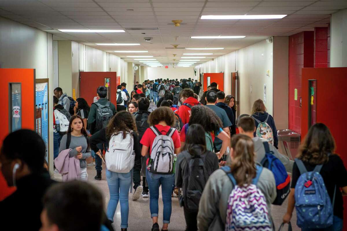 Students pass between classes at Lamar CISD's Terry High School in 2019. Lamar and other school districts are expected to release health, safety and staffing guidance, among other protocols, in the coming weeks ahead of the return to classes in August.