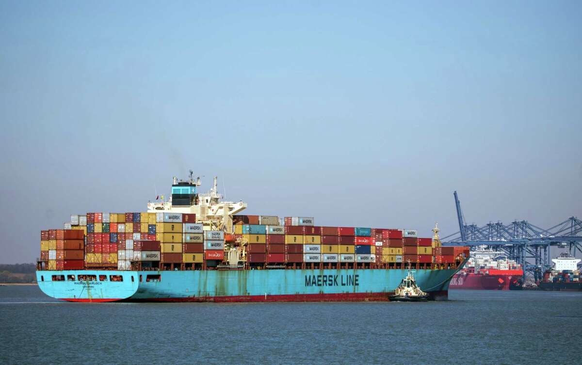 A Svitzer tug boat sits alongside the Maersk Gairloch container ship as it approaches the Port of Felixstowe, in Felixstowe, U.K., on March 25, 2020.