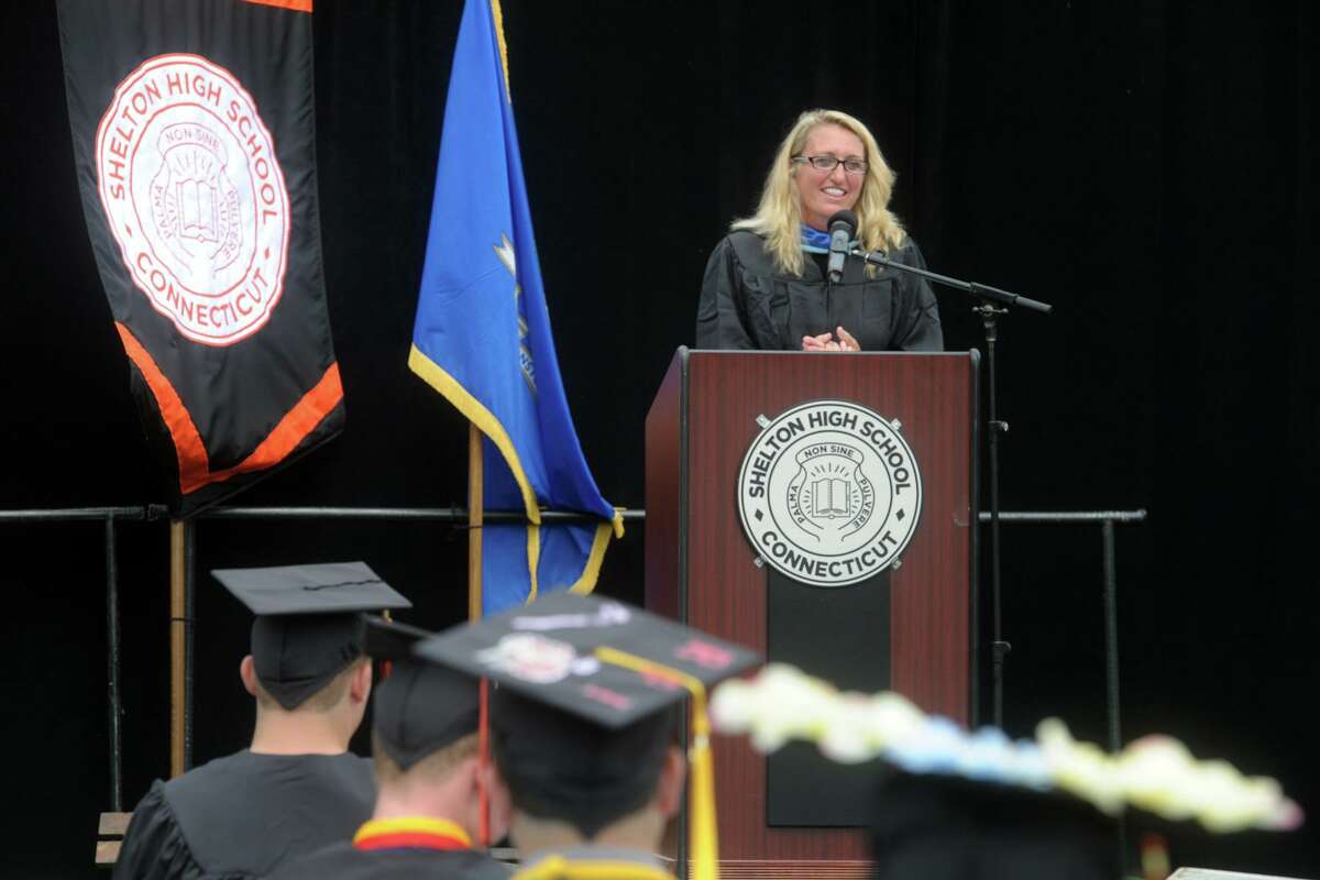Interim Principal Kathy Riddle speaks during the first of three graduation ceremonies held Wednesday for the Shelton High School Class of 2020, in Shelton, Conn. July 8, 2020.