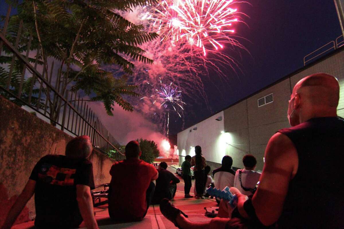The July 4th holiday fireworks display is held at Veterans Memorial Park in Shelton, Conn., on Wednesday July 8, 2020. Due to the coronavirus pandemic, crowds weren't allowed to gather in the park, but were able to watch from the roads and homes nearby.