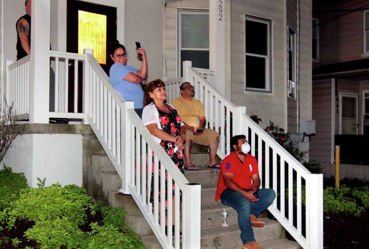 The July 4th holiday fireworks display is held at Veterans Memorial Park in Shelton, Conn., on Wednesday July 8, 2020. Due to the coronavirus pandemic, crowds weren't allowed to gather in the park, but were able to watch from the roads and homes nearby.