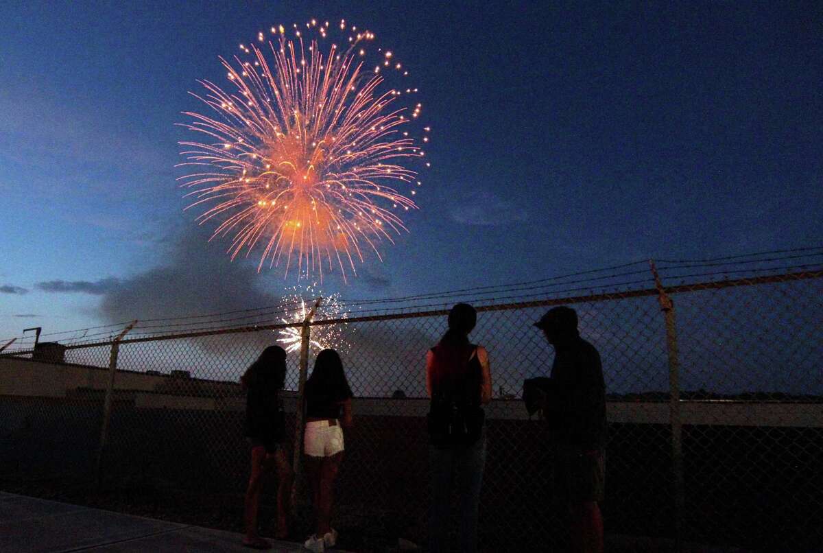 The July 4th holiday fireworks display is held at Veterans Memorial Park in Shelton, Conn., on Wednesday July 8, 2020. Due to the coronavirus pandemic, crowds weren't allowed to gather in the park, but were able to watch from the roads and homes nearby.