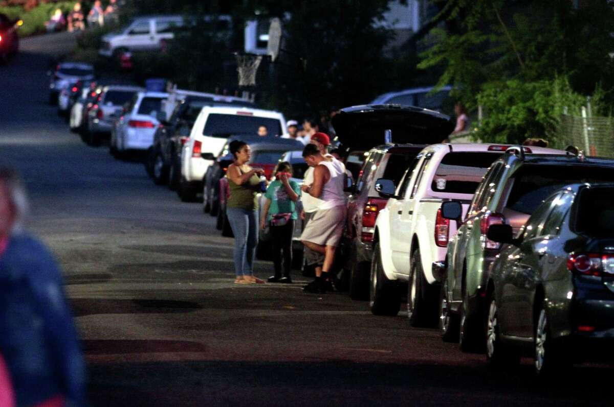 The July 4th holiday fireworks display is held at Veterans Memorial Park in Shelton, Conn., on Wednesday July 8, 2020. Due to the coronavirus pandemic, crowds weren't allowed to gather in the park, but were able to watch from the roads and homes nearby.