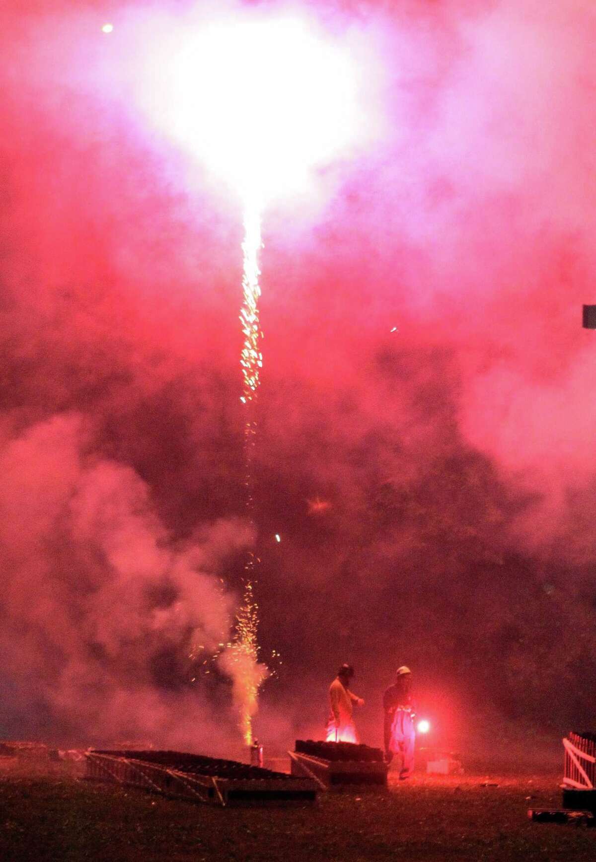 The July 4th holiday fireworks display is held at Veterans Memorial Park in Shelton, Conn., on Wednesday July 8, 2020. Due to the coronavirus pandemic, crowds weren't allowed to gather in the park, but were able to watch from the roads and homes nearby.