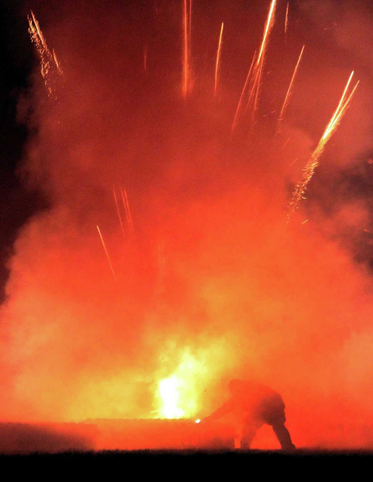The July 4th holiday fireworks display is held at Veterans Memorial Park in Shelton, Conn., on Wednesday July 8, 2020. Due to the coronavirus pandemic, crowds weren't allowed to gather in the park, but were able to watch from the roads and homes nearby.