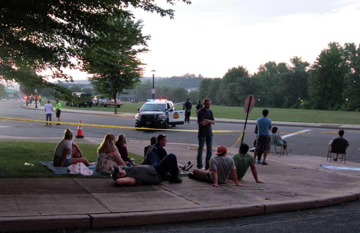 The July 4th holiday fireworks display is held at Veterans Memorial Park in Shelton, Conn., on Wednesday July 8, 2020. Due to the coronavirus pandemic, crowds weren't allowed to gather in the park, but were able to watch from the roads and homes nearby.