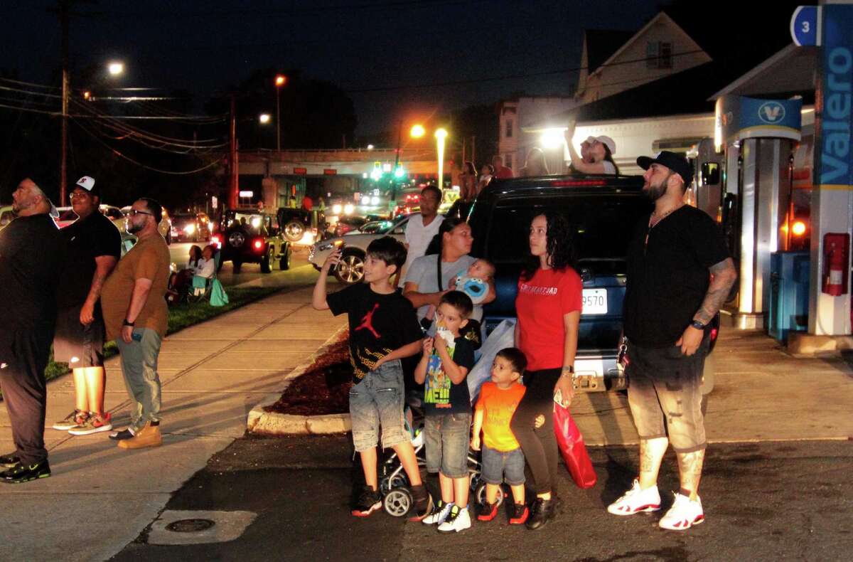 The July 4th holiday fireworks display is held at Veterans Memorial Park in Shelton, Conn., on Wednesday July 8, 2020. Due to the coronavirus pandemic, crowds weren't allowed to gather in the park, but were able to watch from the roads and homes nearby.