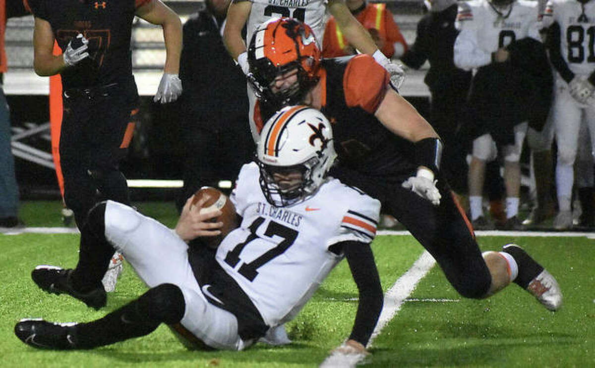 Edwardsville linebacker Jacob Morrissey chases down St. Charles East quarterback Nathan Hayes in the second quarter.