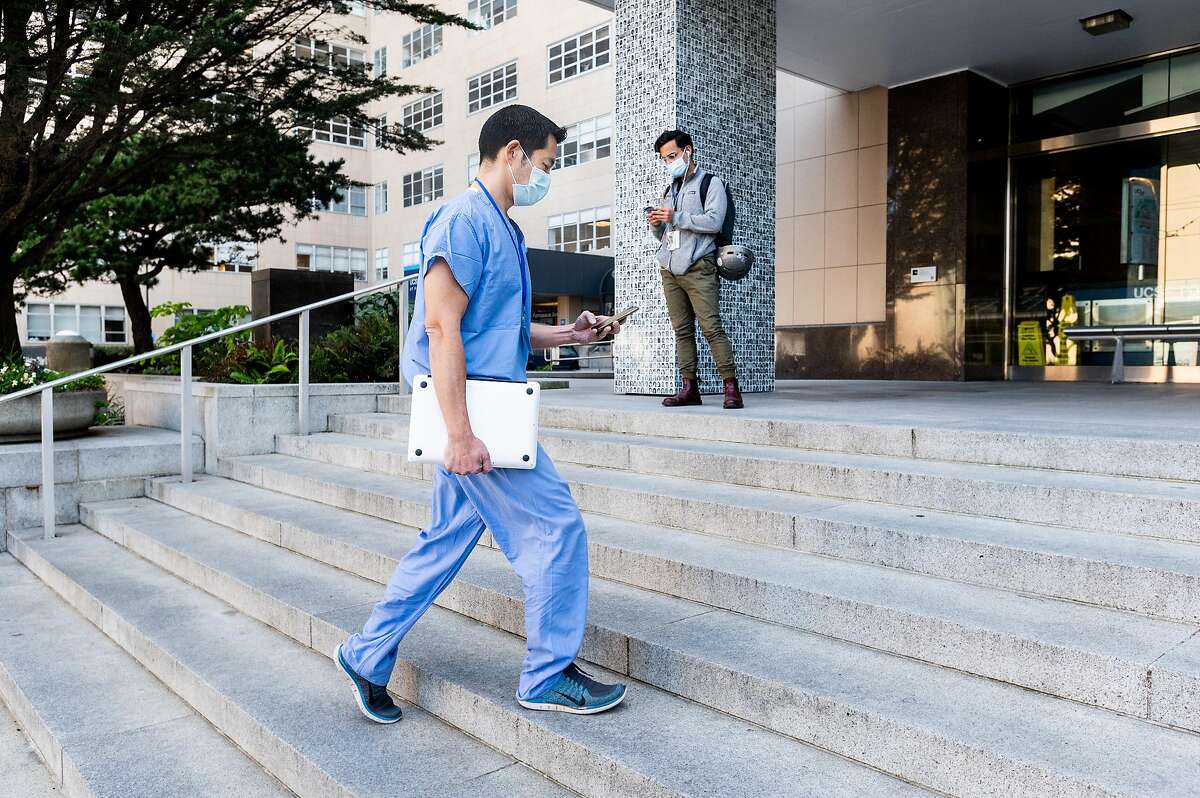 Dr. Peter Chin-Hong enters UCSF Medical Center on Friday, April 3, 2020, in San Francisco. Dr. Chin-Hong and fellow UCSF physicians are using Twitter to help educate the public about the frightening and evolving coronavirus outbreak.
